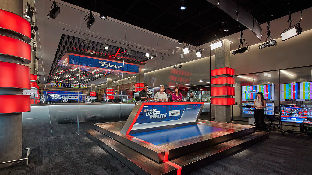 A group of people in a bowling alley.